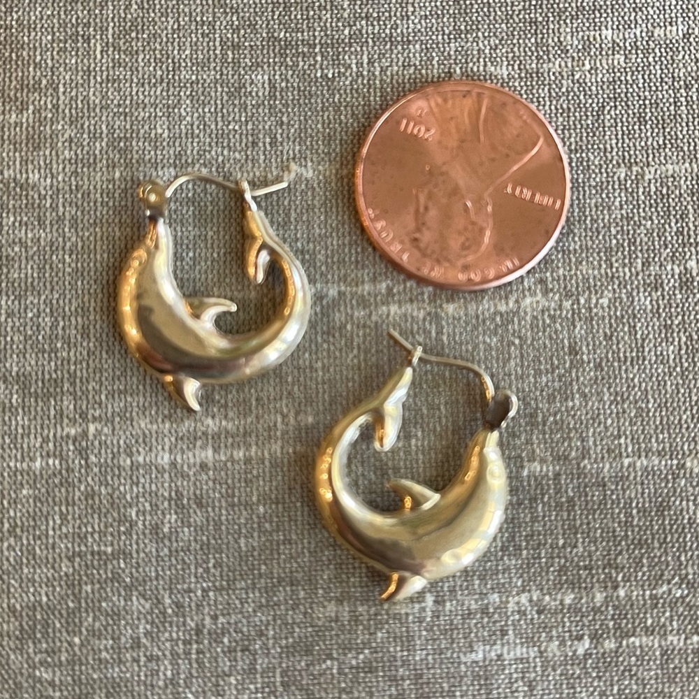 14K gold.  Solid. Yellow. 1.03 grams.  Dolphin hoop earrings